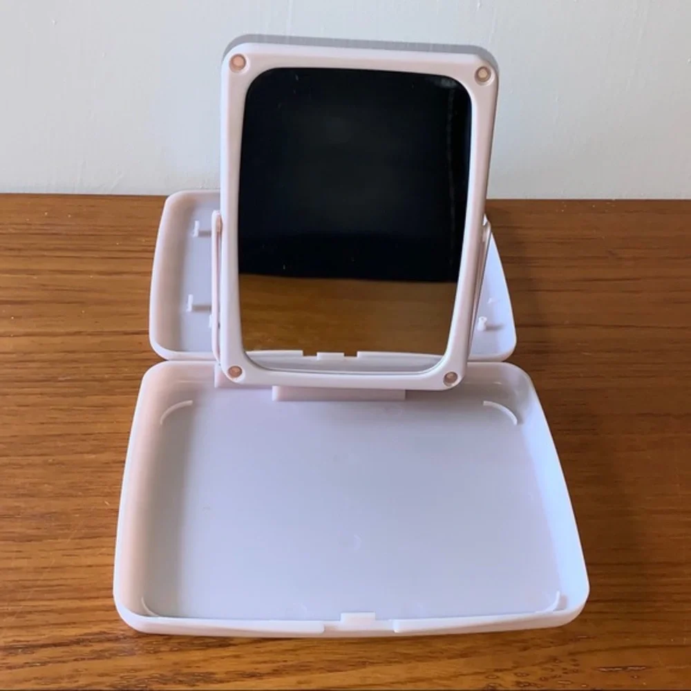 Mary Kay pink plastic compact travel mirror.
